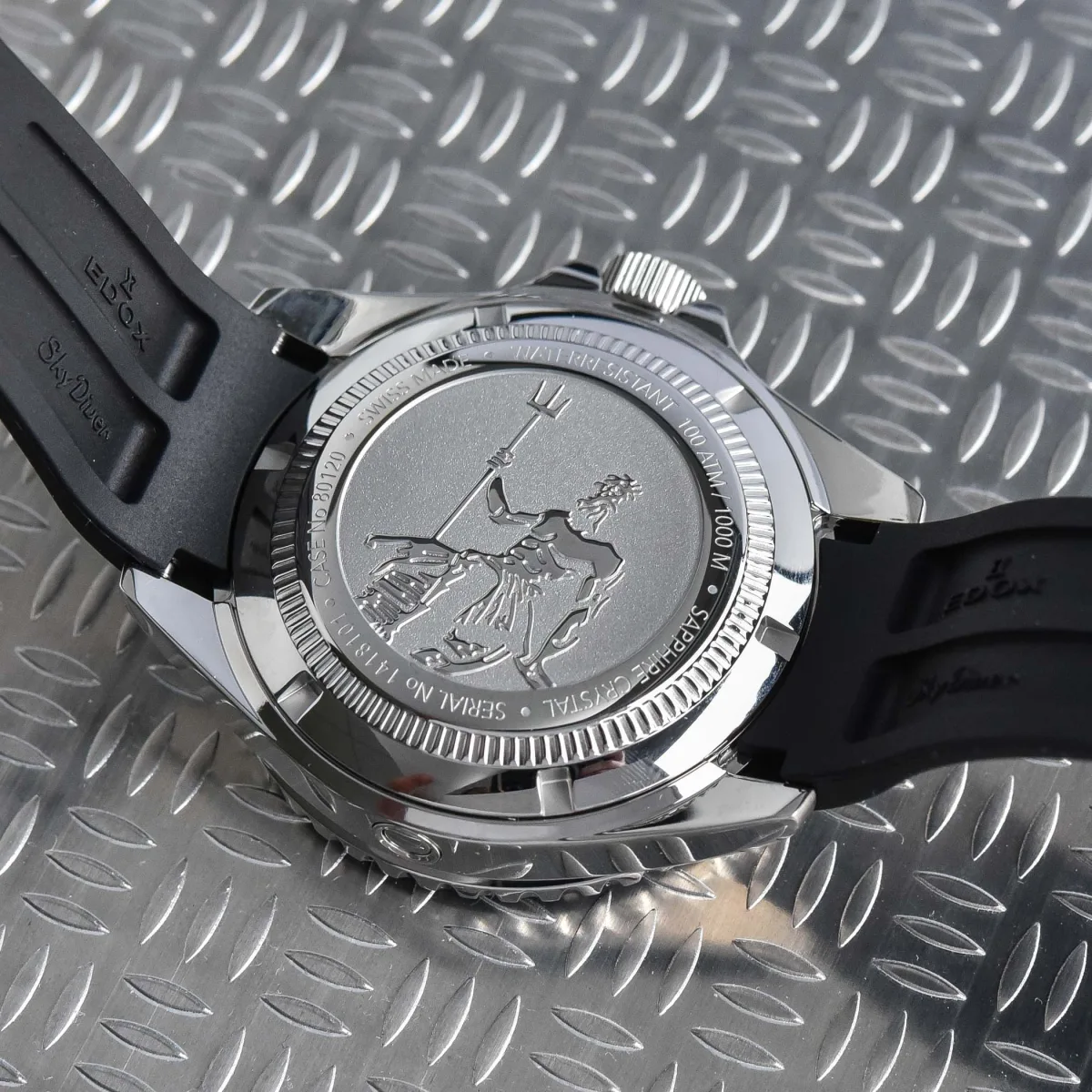 Detailed engraving of Neptune on Edox watch case back