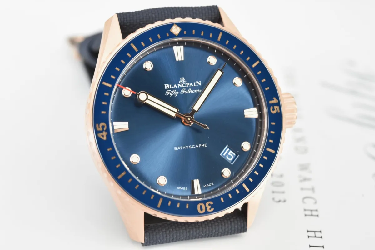 Side view of the Sedna Gold case and blue canvas strap