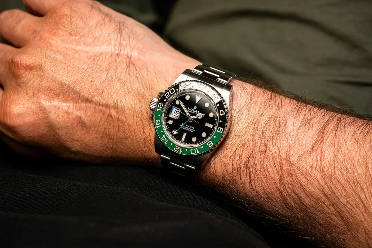 Close-up of Rolex watch face showing intricate details.