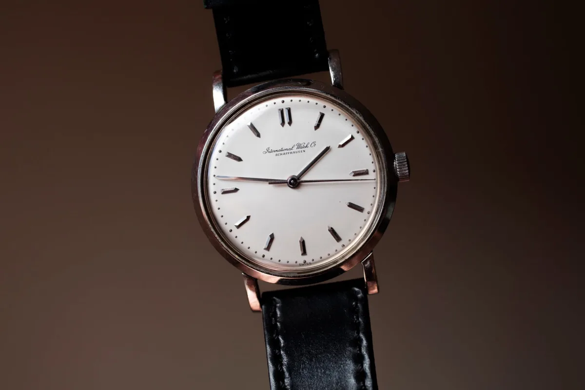 Watchmaker servicing a mechanical watch