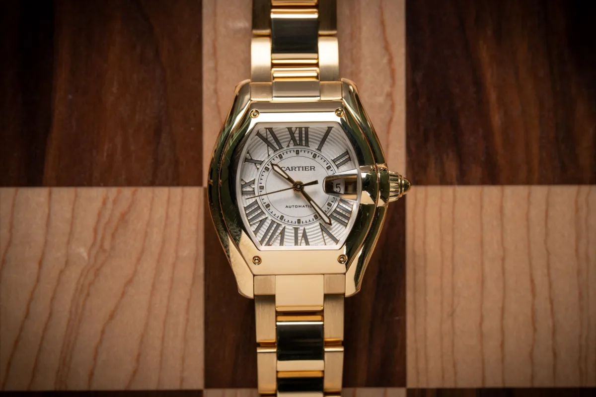 Close-up of Cartier Roadster dial with polished silver date frame